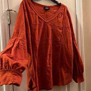 Long sleeve top. Like new. Smoke free & pet free home.